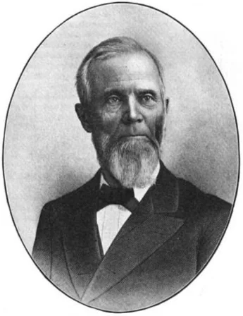 Halftone portrait of Edmund Burke Fairfield in later life: an oval photograph of a bearded man in a dark coat and bow tie.